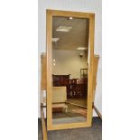 A large rectangular pine mirror,