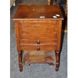 An early 20th century oak rectangular workbox, hinged top over two drawers,