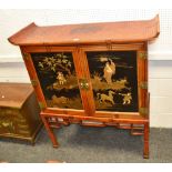 An Oriental faux bamboo cabinet on stand, upswept oversailing top,