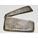 A silver bowed card case, engraved and chased with foliate scrolls, 8cm wide,