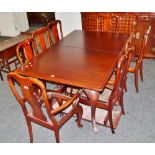 A 20th century cherry stained draw leaf dining table dining table;