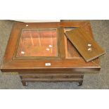 An oriental coffee table, glazed copper cavity, smaller rectangular cavity, oversailing top,