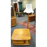 An Ercol coffee table, square top, rounded corners above two short drawers,