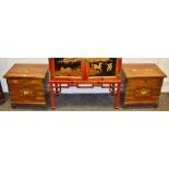 A pair of oriental style bedside cabinets,