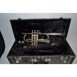 A Yamaha silver plated E Flat trumpet,