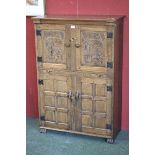 An oak Rupert Griffith Flemish wine cupboard,