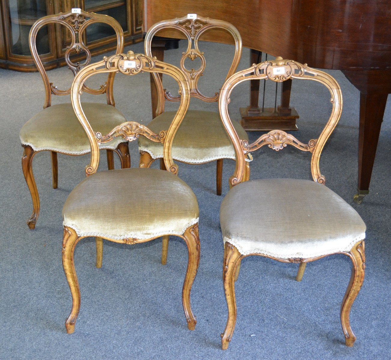A pair of late Victorian walnut bedroom chairs, balloon back carved top, carved horizontal splat,