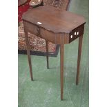 A early 20th century mahogany lozenge shaped work table, hinged top, tapering square supports.