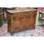 A Titchmarsh and Goodwin small sideboard, two short drawers over two fielded panel door cupbaord.