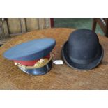 A Russian officers hat; a bowler hat by Dunn & Co.