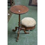 A fruitwood circular pedestal tripod wine table,
