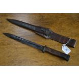 A German bayonet and scabbard with leather frog,