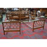 A pair of Sheraton Revival satinwood crossbanded single beds, by Heal & Sons, London, c.