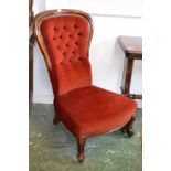 A Victorian mahogany balloon back chair with button back turned legs c.1880.