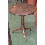 An 18th century oak tilt top wine table,