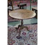 A George III oak birdcage tripod table, circular top, baluster turned column, cabriole legs,