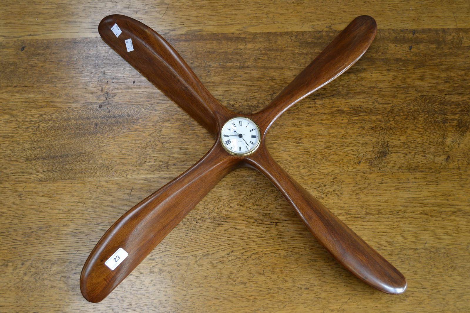 A mahogany propeller wall clock