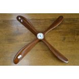 A mahogany propeller wall clock