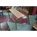 A mid-20th century French school table and chairs, tubular metal frame,