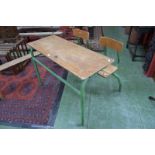 A mid-20th century French school table and chairs, tubular metal frame,