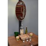 A large Bells whisky bottle; a flower bucket; a vintage oval mirror; two flower pots;