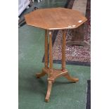 A Victorian ash occasional table, octagonal top supported by three columns, triform base,