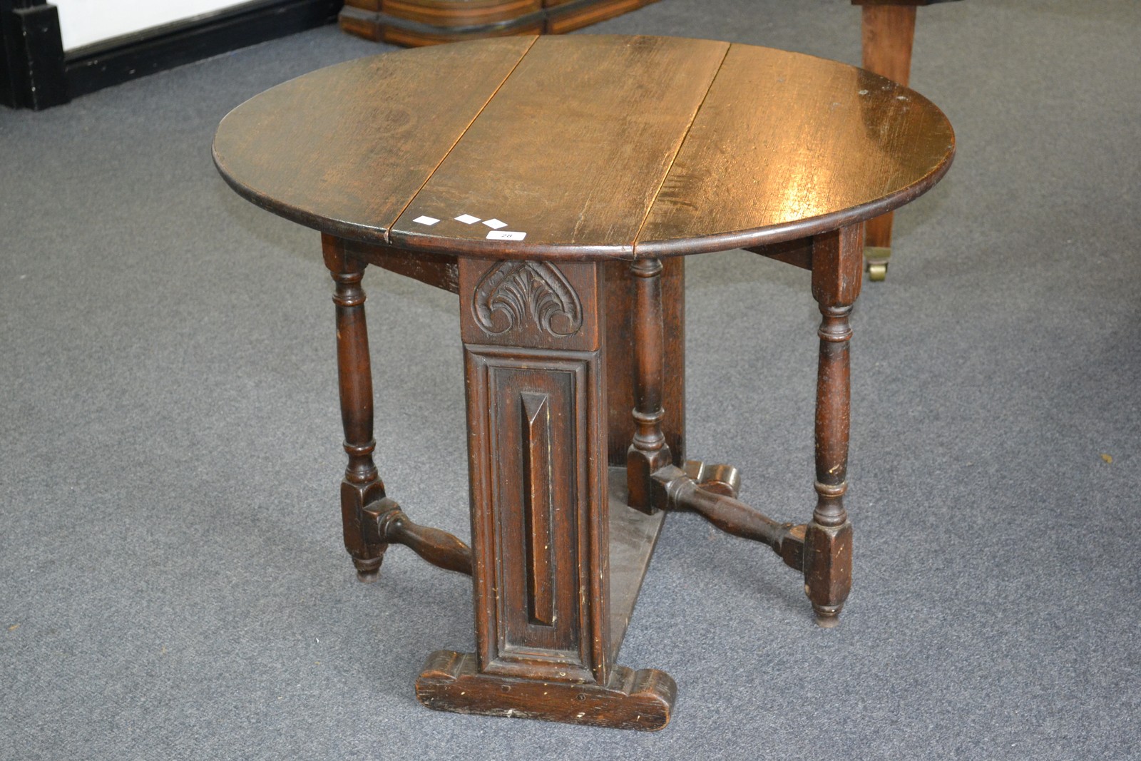 An oak gateleg occasional table circa 1800.