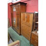 An Edwardian mahogany inlaid bedroom suite comprising wardrobe, stepped cornice,