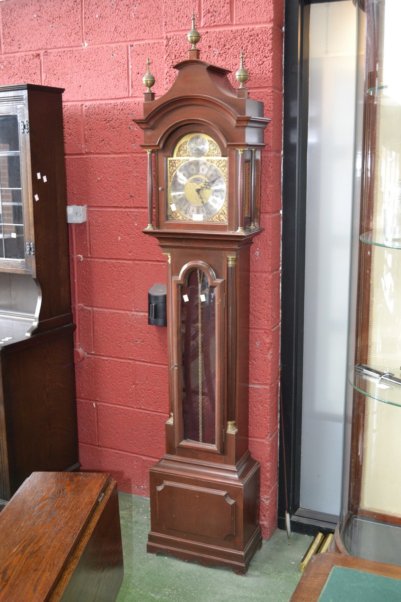 A modern mahogany long case clock, pagoda top to hood supported on brass tipped fluted columns,