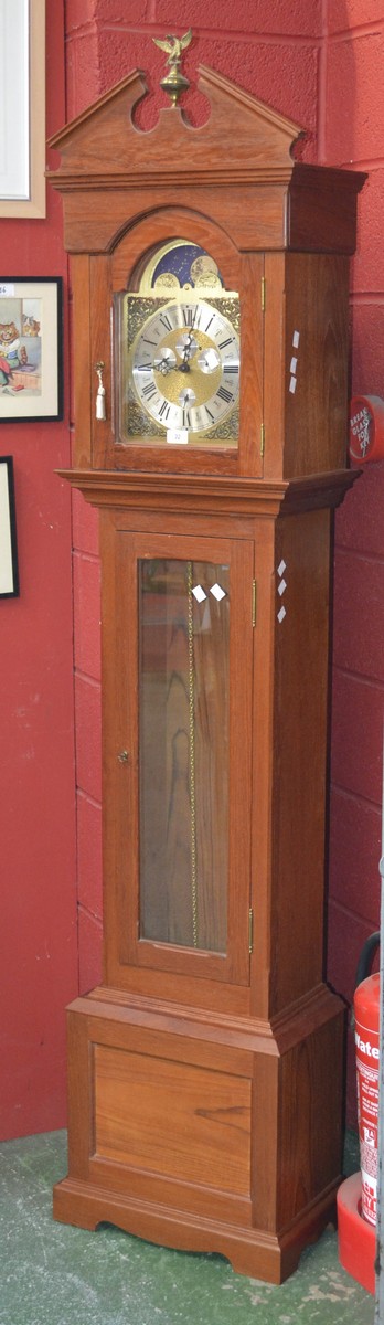 A Franz Hermle reproduction teak long case clock, architectural pediment, arched face,