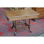 An early 20th century oak card table of large proportions, rectangular top with canted corners,