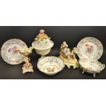 A Continental figural group of children playing; a pair of pierced plates; a Dresden basket;