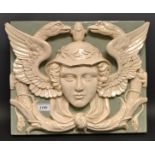 A Continental earthenware figural plaque, moulded as the head of Minerva,