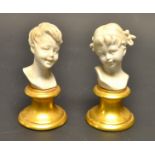 A pair of Naples miniature busts of young children