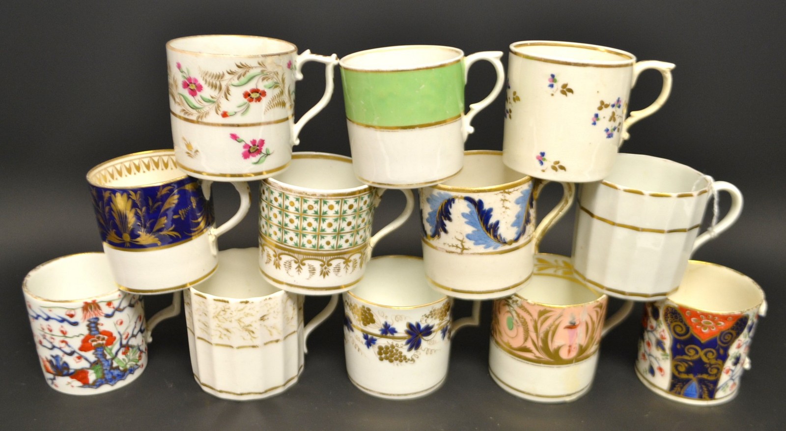A Derby fluted coffee can, pattern 561, crown, crossed batons, D mark in puce; other,