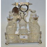A silver plated and cut glass condiment set;