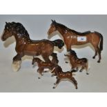 A Beswick cantering bay Shire Horse; a Beswick bay Racehorse; a Beswick Foal;