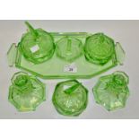 An Art Deco green glass dressing table set comprising of candlesticks,