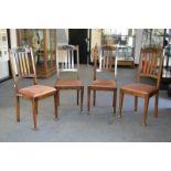 A set of four oak high back dining chairs