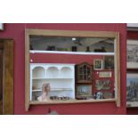 A large pine framed rectangular over mantle wall mirror