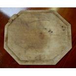 A Robert Thompson Mouseman octagonal bread board, with carved mouse signature,