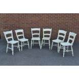 A harlequin set of six painted bar back chairs