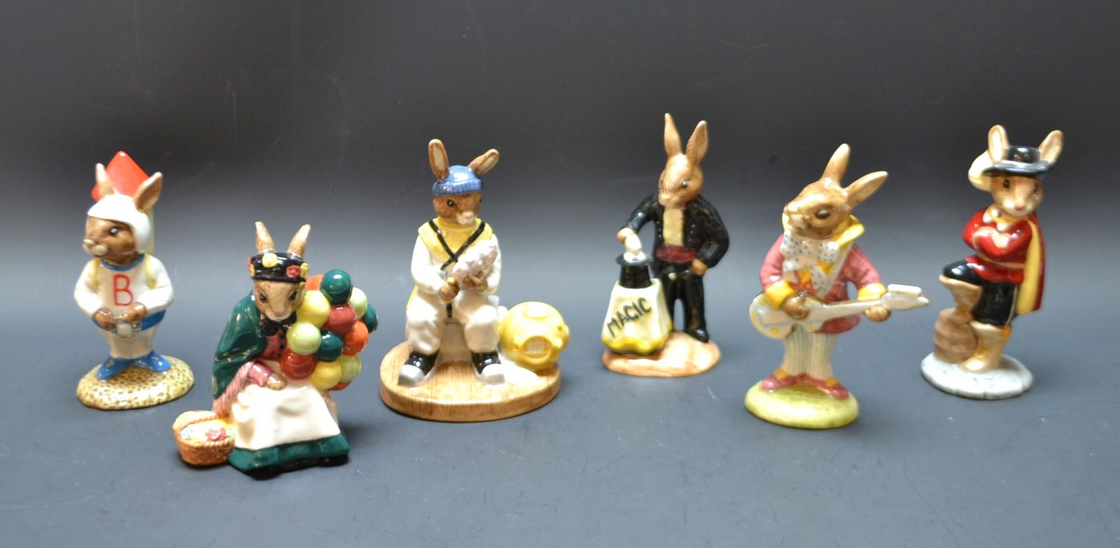 A Royal Doulton Bunnykins figure of Mr Bunny Beat Strumming, boxed; others, Deep Sea Diver,