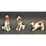 A Royal Doulton model of a puppy with a ball, HN 1103; two others HN1099,