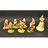 A Royal Doulton Snow White and the seven Dwarves set, comprising SW9, Snow White, SW10 Doc,