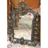 A French Rococo style cast iron looking-glass,