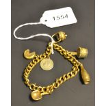 A 19th century gold coloured metal charm bracelet, with a selection of gold coloured charms,