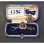 A Sterling silver and enamel Naval brooch;