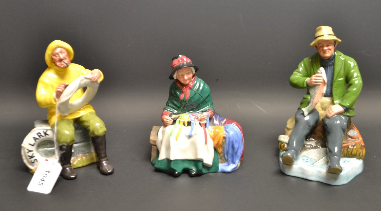 A Royal Doulton figure, A Good Catch, HN2258; others, The Boatman, HN2417, Silk and Ribbons,