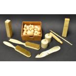 A collection of ivory beads, brushes, etc.